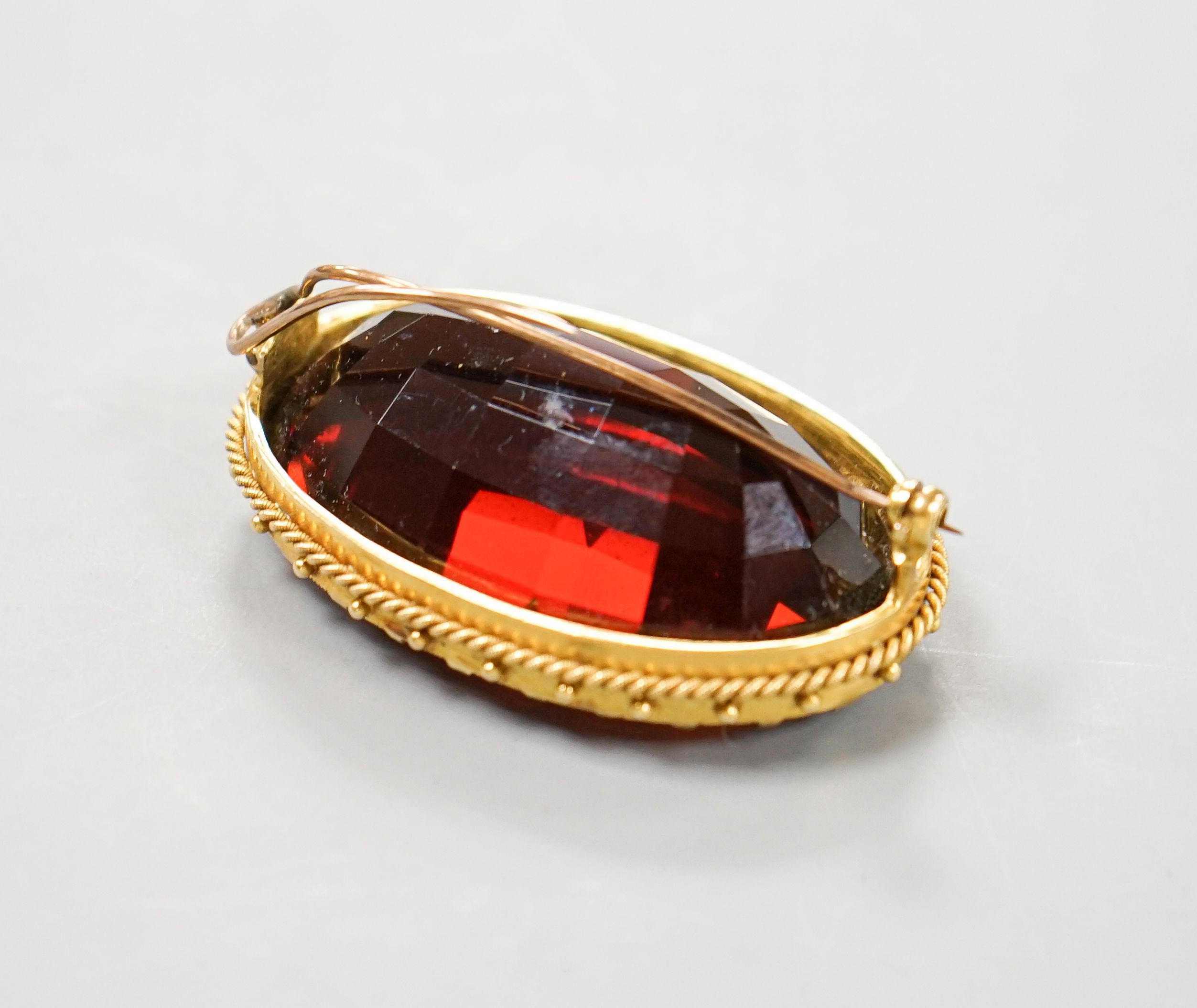 A large yellow metal mounted dark citrine brooch, 48mm, gross weight 37.9 grams.